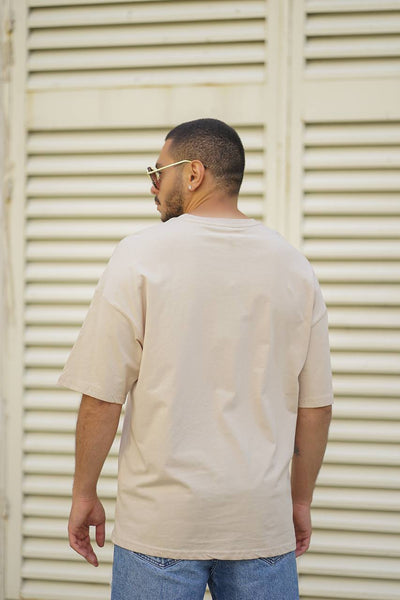 Cremefarbenes Oversize-T-Shirt mit Totenkopf-Stickerei